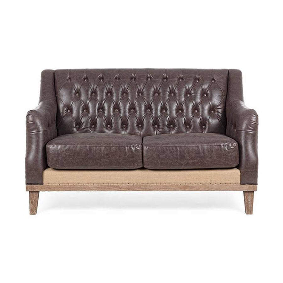 Loft stílusú, sötétbarna bőrrel kárpitozott kőrisfa kanapé.