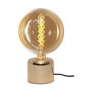 Fényes sárgaréz felületű, modern stílusú asztali dekorfoglalat.