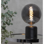 Fekete színű, loft és modern stílusú asztali dekorfoglalat.