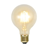 Clear Filament dekorációs izzó. Meleg fehér fényű LED dekorációs izzó áttetsző üveggel.