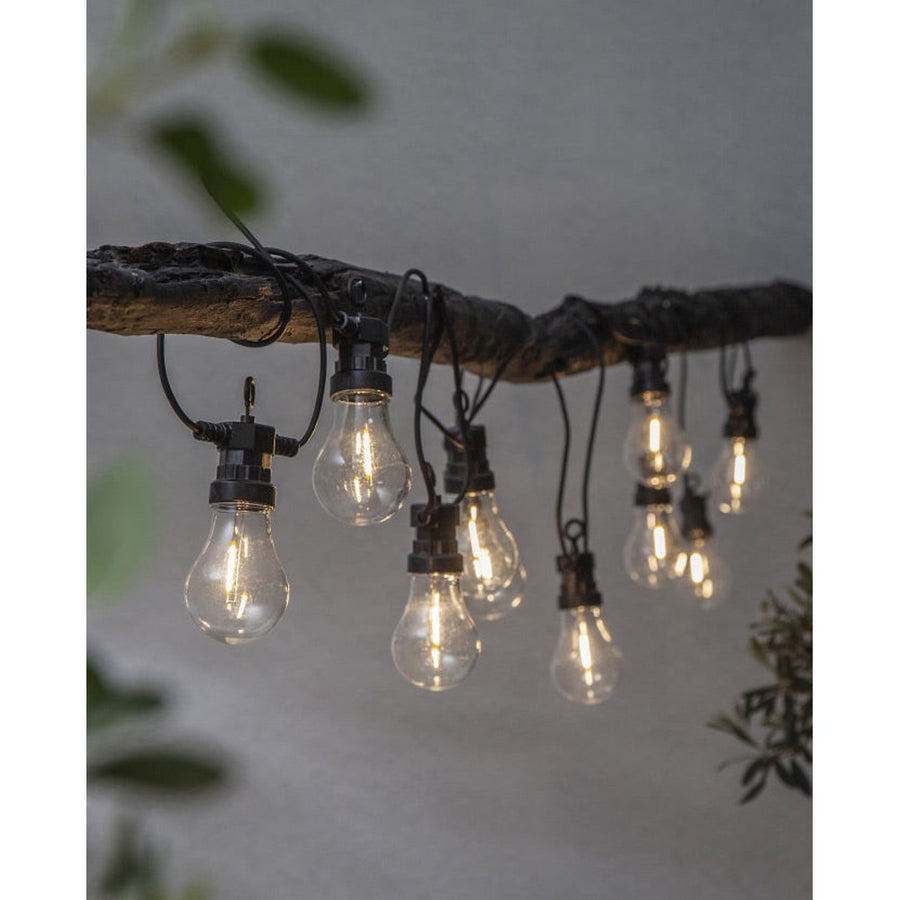 Kültéri LED dekorációs izzósor. 10 darab áttetsző búrás izzóval, fekete kábellel.