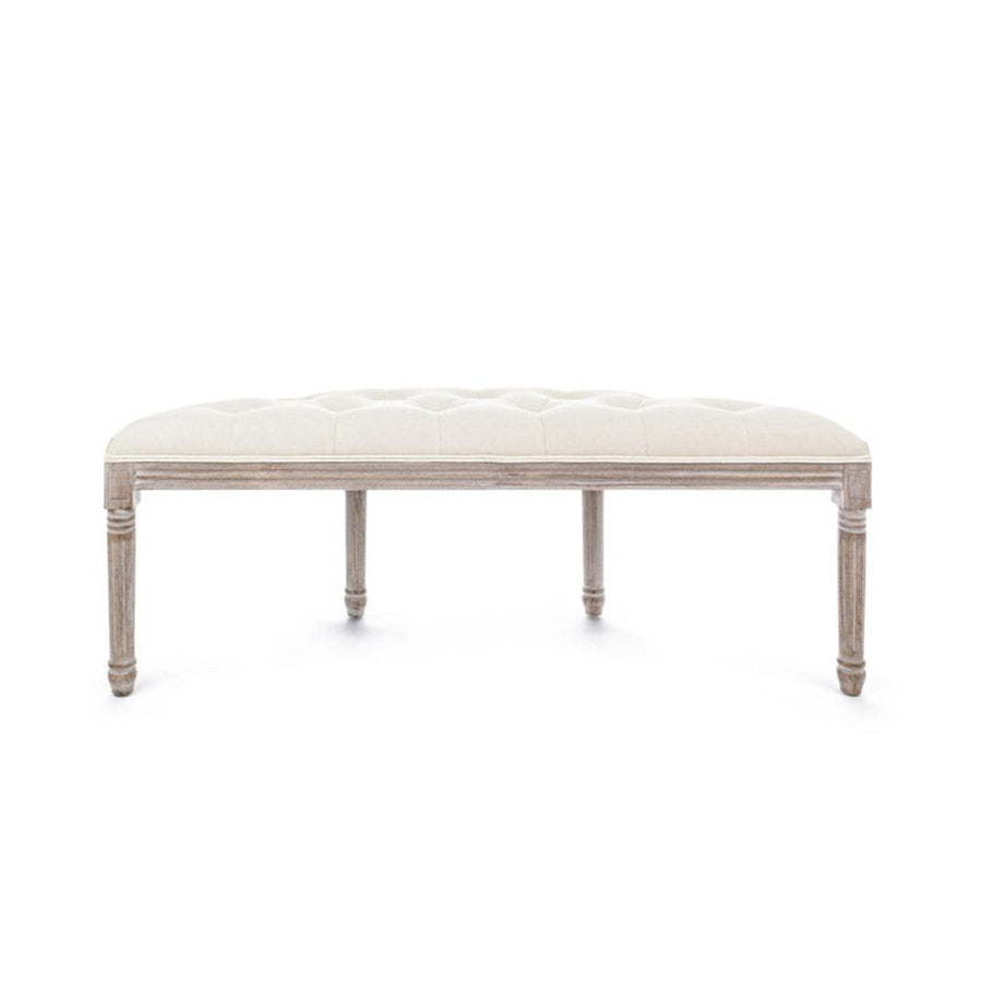 Koloniál stílusú, nyírfából és kaucsukfából készült, bézs színű, bársonyhatású textíliával kárpitozott kézműves ülőpad.