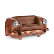 Bronz színű autófront kanapé, bőr üléssel és működő autólámpákkal.