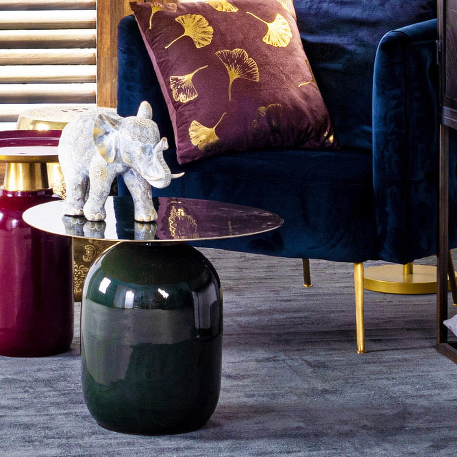 Kortárs stílusú, zománcozott acélból készült, sötétzöld-arany színű kisasztal.