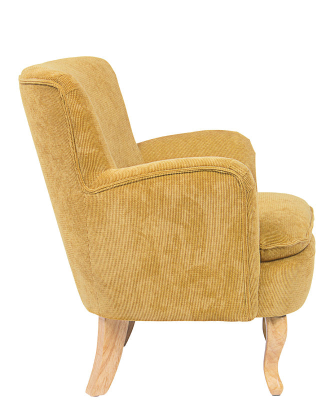 Retró stílusú, okkersárga színű, kordbársony-hatású szövettel kárpitozott kaucsukfa fotel.