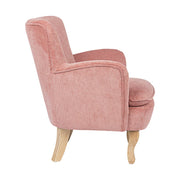 Retró stílusú, púderrózsaszín színű, kordbársony-hatású szövettel kárpitozott kaucsukfa fotel.