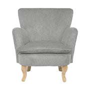 Retró stílusú, világosszürke színű, kordbársony-hatású szövettel kárpitozott kaucsukfa fotel.