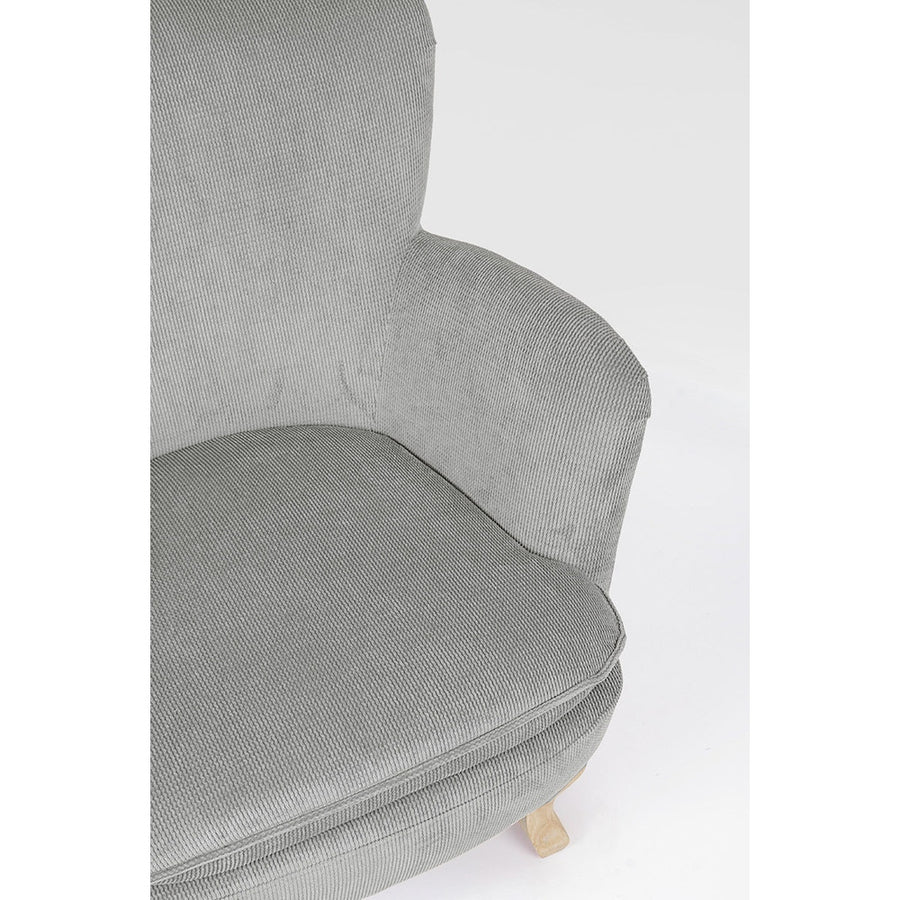 A retró stílusú, világosszürke színű fotel ülőpárna és karfa részlete.