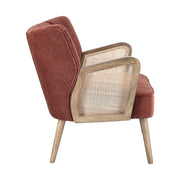 Retró stílusú, téglavörös színű bársonyhatású szövettel kárpitozott kaucsukfa klubfotel.