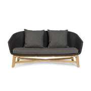 Prémium kategóriás, design kerti kanapé sötétszürke színű párnákkal.