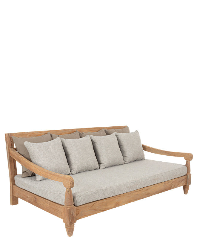 Keleti stílusú teakfa kanapé bézs színű ülő- és hátpárnákkal.