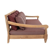 Keleti stílusú teakfa kanapé bordó színű ülő- és hátpárnákkal.