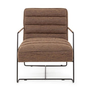 Barna színű velúr műbőrrel kárpitozott kortárs stílusú fotel.