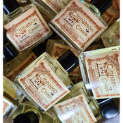 Több Cinnamon Creek illóolajos üveg egy kosárban, Enchante kollekció