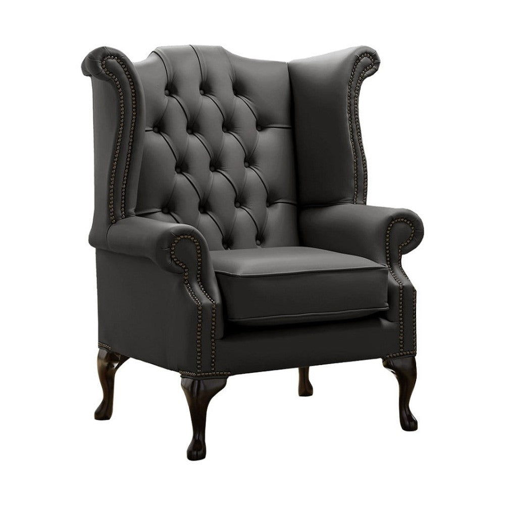 Antracitszürke színű bőrrel kárpitozott Chesterfield szárnyas fotel.