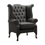 Antracitszürke színű bőrrel kárpitozott Chesterfield szárnyas fotel.