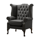 Antracitszürke színű bőrrel kárpitozott Chesterfield szárnyas fotel.