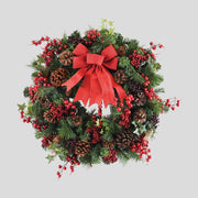 Vidéki stílusú, erdei bogyós, 60 cm átmérőjű karácsonyi koszorú masnival.