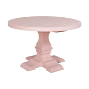 Fenyőfából készült kerek étkezőasztal vastag oszloplábon. A bútor színe krémszín.