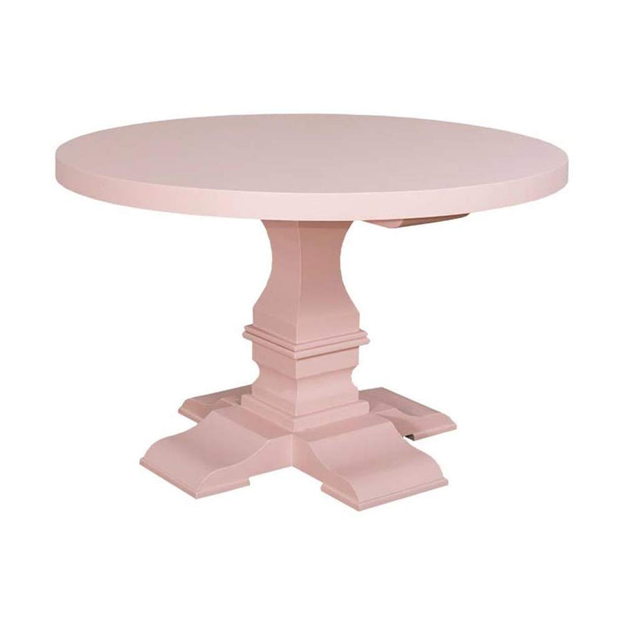 Fenyőfából készült kerek étkezőasztal vastag oszloplábon. A bútor színe krémszín.