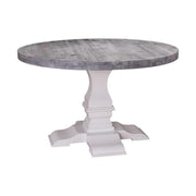 Fenyőfából készült kerek étkezőasztal vastag oszloplábon. Az asztallap pácolt szürke, az asztalláb fehér színű.