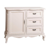 Fehér színű, shabby chic stílusú fenyőfa komód  három fiókkal és egy ajtós tárolóval.