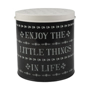 Fémből készült, fekete és fehér színű, motívumokkal és "Enjoy the little things in life" felirattal díszített konyhai tárolódoboz