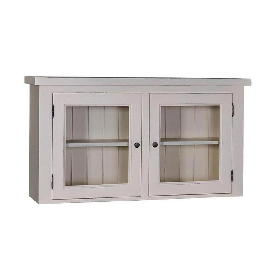 Bézs-színű fali konyhaszekrény, két üveges ajtóval. A tárolást egy polc segíti elő.