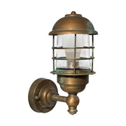 Industrial stílusú, antikolt sárgaréz színű, réz falikar átlátszó üvegbúrával.