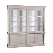 Prémium fenyőfa vitrin-könyvszekrény két darab kétszárnyú üveges ajtóval a felső részen, két darab kétszárnyú ajtóval az alsó részen. A bútor külső színe bézs, belül fehér.