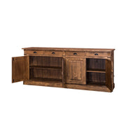 Kétosztatú country és klasszikus stílusú fenyőfa tálaló négy fiókkal, és kétszer két ajtós tárolóval. Színe: mélyen csiszolt, lakkozott natúr..