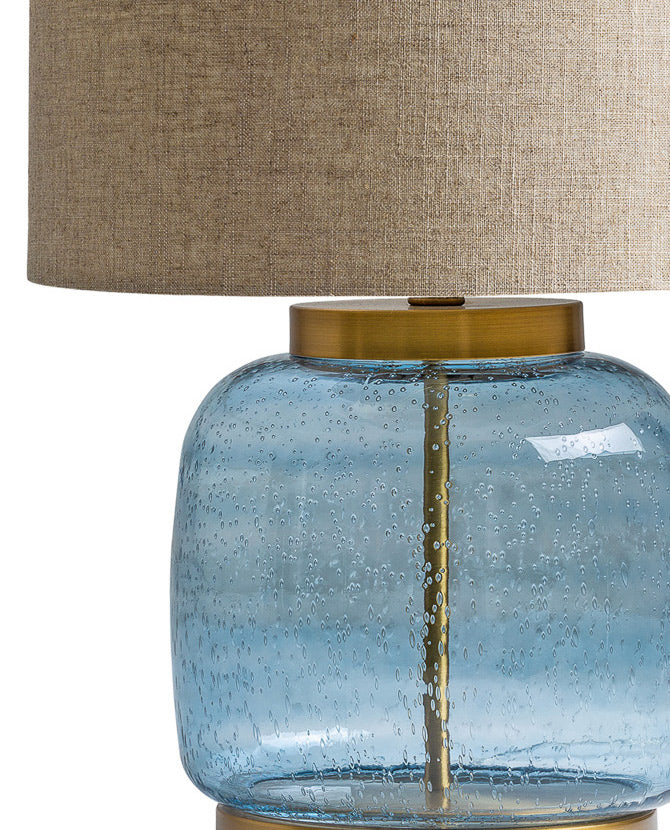 Kortárs stílusú, üvegből és fémből készült, dizájn asztali lámpa natúr színű lenvászon lámpaernyővel.
