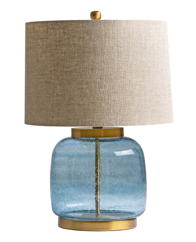 Kortárs stílusú, üvegből és fémből készült, dizájn asztali lámpa natúr színű lenvászon lámpaernyővel.