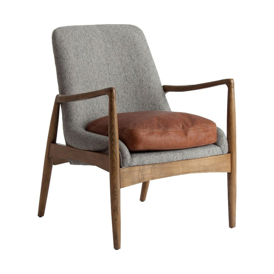 Loft stílusú, jegenyefenyőből készüt, szürke színű mintás textíliával kárpitozott fotel bőr párnával.