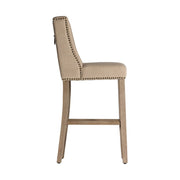 Koloniál stílusú, fenyőfából készült bárszék natúr színű vászon kárpitozással.