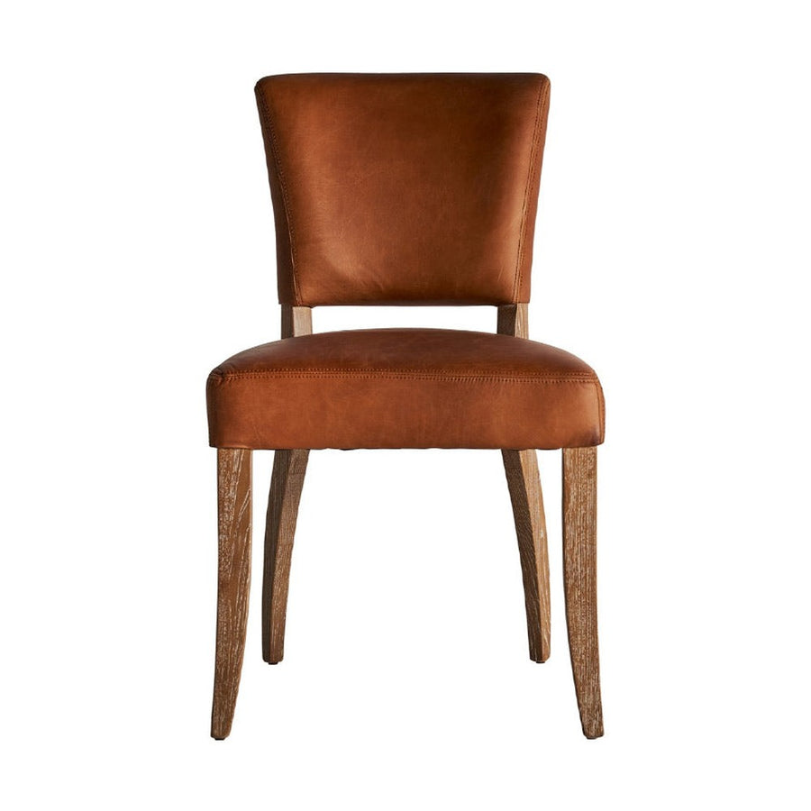 Kortárs stílusú étkezőszék nyírfából és bőrből.