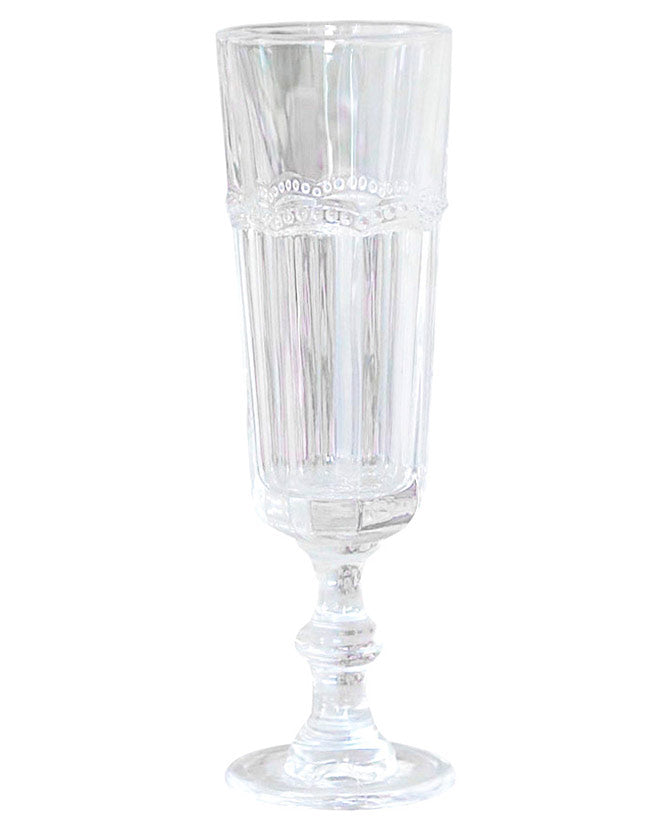 Vintage stílusú, pontozott dombormintával díszített átlátszó üvegű pezsgőspohár.