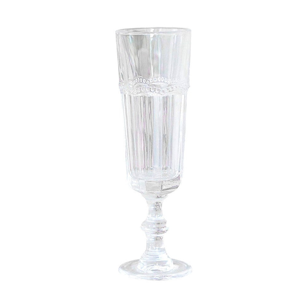 Vintage stílusú, pontozott dombormintával díszített átlátszó üvegű pezsgőspohár.
