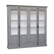 Impozáns fenyőfa könyvszekrény, két darab kétszárnyú ajtóval, melyek mindegyike kétharmad részt üvegezett. A bútor külső színe szürke, belül világos fehér.