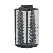 Fémleveles ággal díszített, vintage stílusú, patinás felületű fémből készült lámpás.