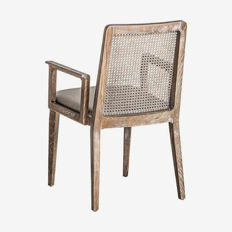 Art Deco stílusjegyeket mutató, kőrisfából és rattanból készült kortárs karosszék, bézs színű vászonnal kárpitozott ülőfelülettel.