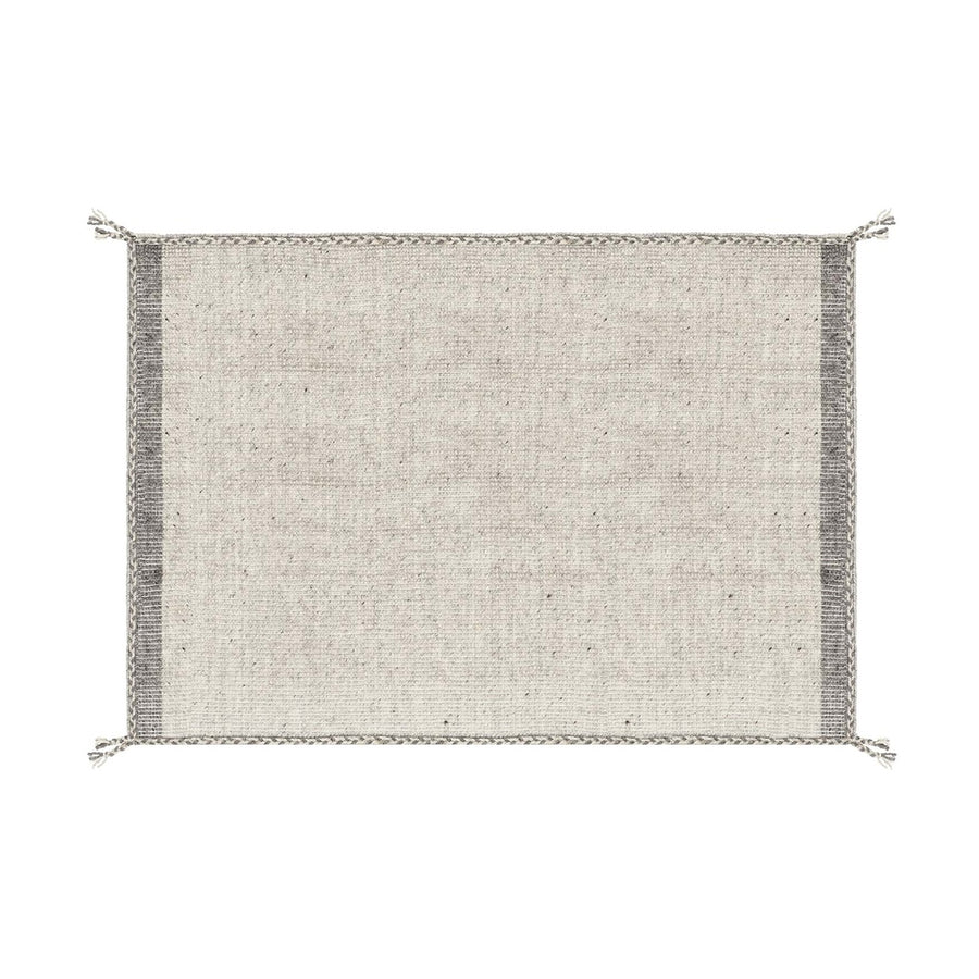 Bézs színű gyapjú szőnyeg.