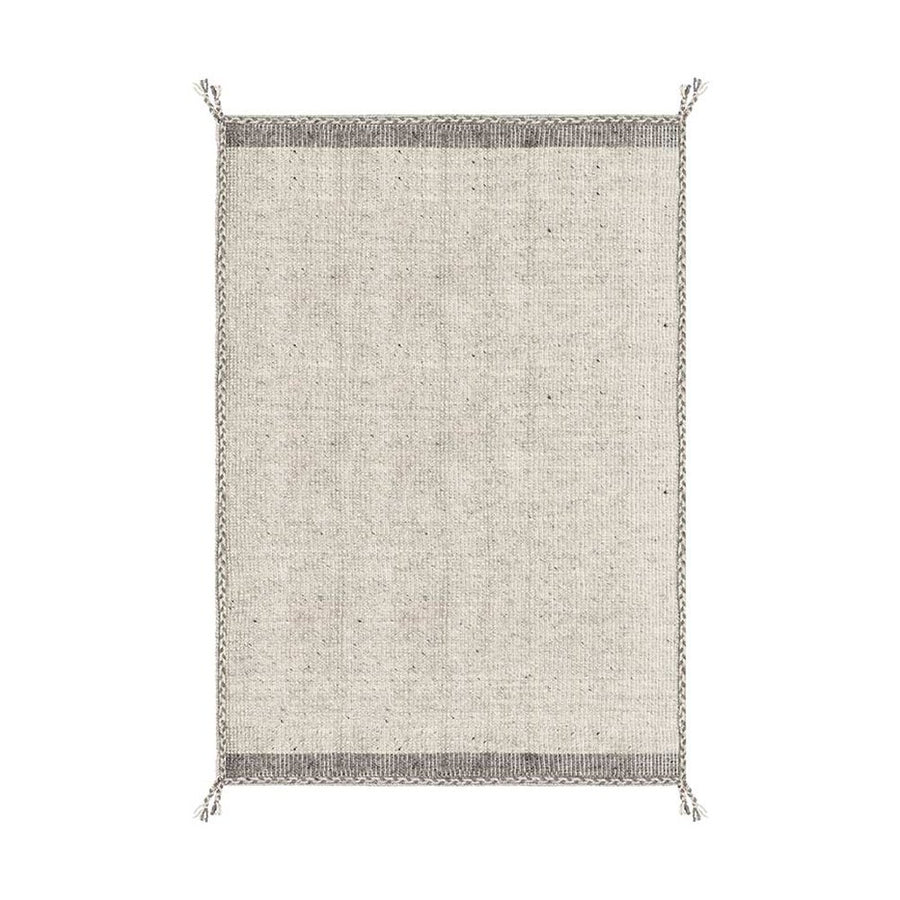 Bézs színű gyapjú szőnyeg.