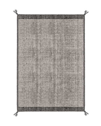 Szürke színű gyapjú szőnyeg.