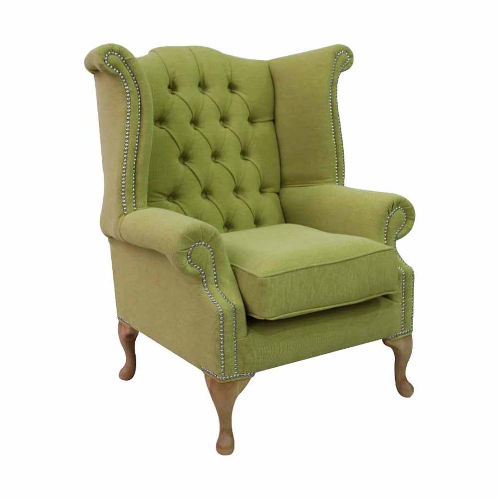 Lime zöld színű szövettel kárpitozott szárnyas Chesterfield fotel.