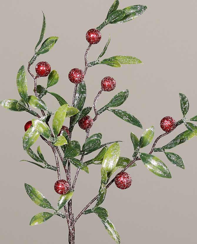 Deres hatású, élethű megjelenésű, 40 cm hosszú, mesterséges piros bogyós karácsonyi ág zöld színű levelekkel.