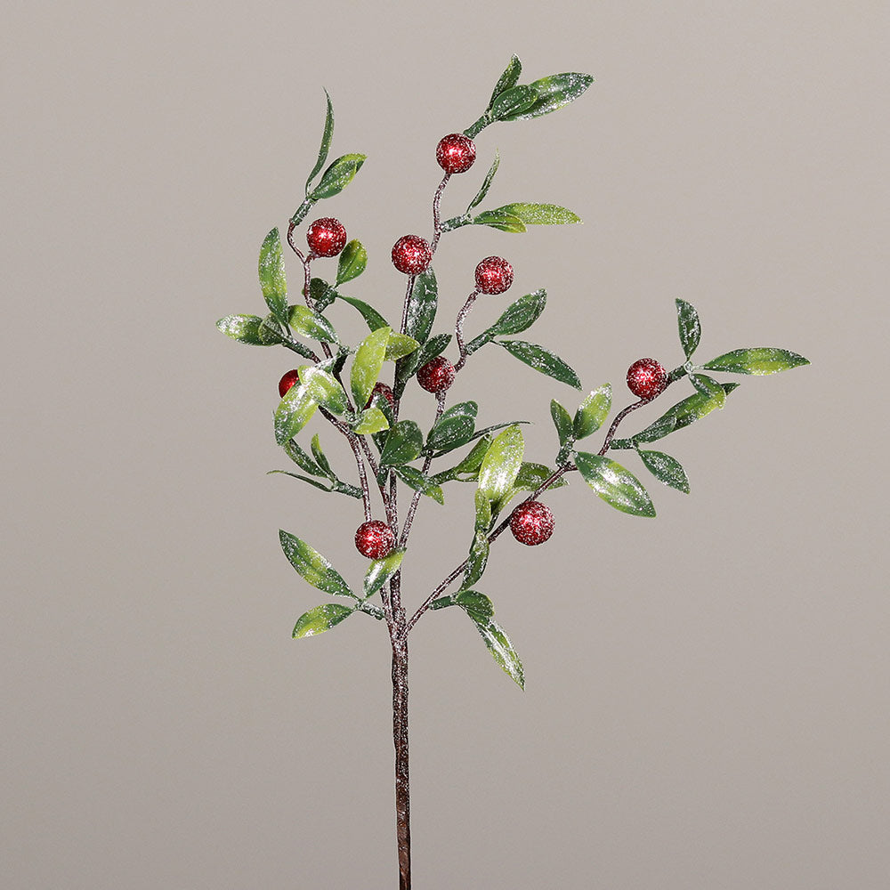 Deres hatású, élethű megjelenésű, 40 cm hosszú, mesterséges piros bogyós karácsonyi ág zöld színű levelekkel.