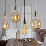 Industrial Vintage dekorációs izzó. Meleg fehér fényű LED dekorációs izzó borostyánszín üveggel.