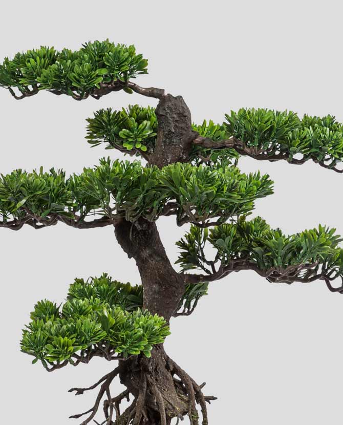 Mesterséges bonsai fa, fekete színű műanyag cserépben.