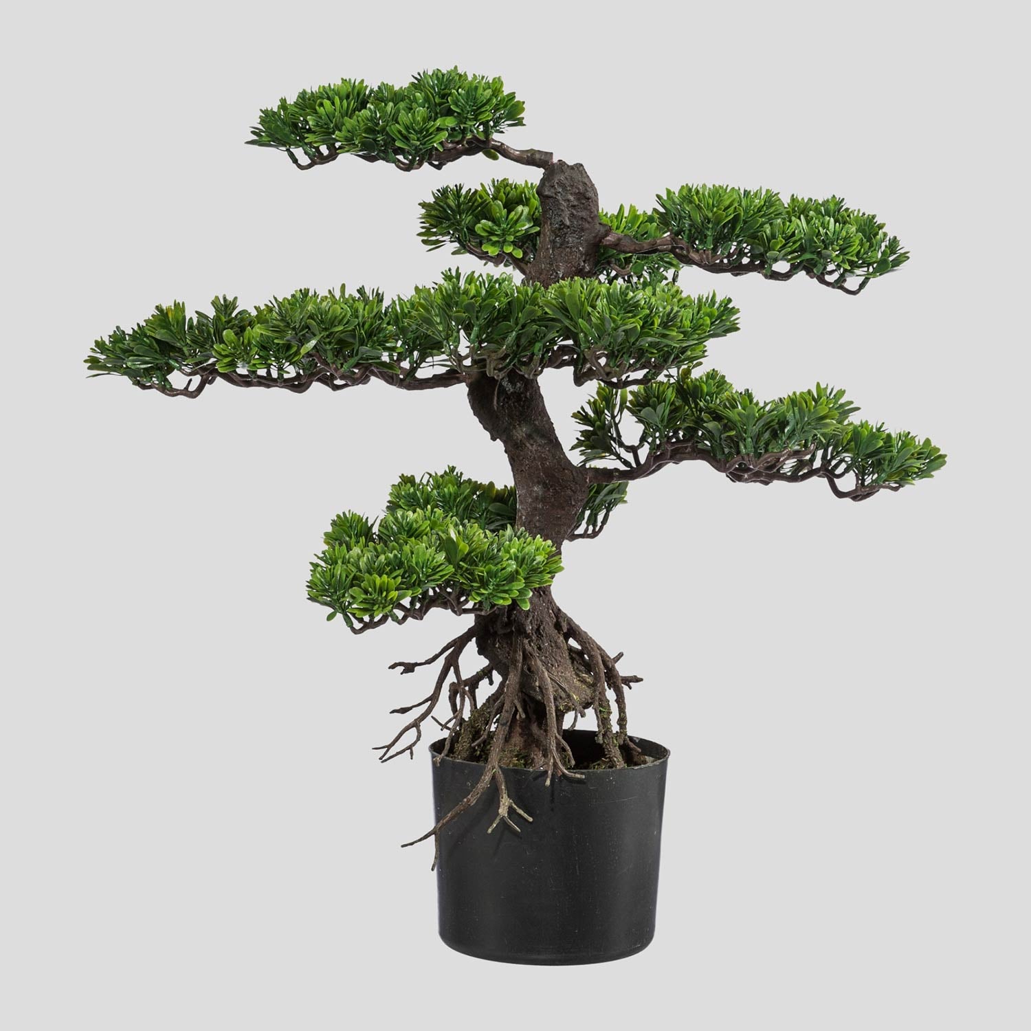 Mesterséges bonsai fa, fekete színű műanyag cserépben.